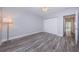 Bedroom with wood-look floors, a ceiling fan, closet and bright light at 1868 Shore S Dr # 410, South Pasadena, FL 33707
