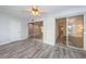 Bedroom with beautiful flooring, access to a screened in patio, and a closet at 1868 Shore S Dr # 410, South Pasadena, FL 33707