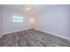 Bedroom features wood-look floors, a ceiling fan, bright light and a nice view at 1868 Shore S Dr # 410, South Pasadena, FL 33707