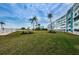 Well-maintained building exterior with lush lawn, landscaping, and waterfront access, offering a desirable lifestyle at 1868 Shore S Dr # 410, South Pasadena, FL 33707