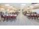 Large recreation room featuring tables, chairs, and a library for community gatherings at 1868 Shore S Dr # 410, South Pasadena, FL 33707
