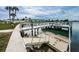 The condo's waterfront dock with boat access and seating offers beautiful views at 1868 Shore S Dr # 410, South Pasadena, FL 33707