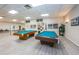 Well-equipped game room with pool tables and recreational activities at 1868 Shore S Dr # 410, South Pasadena, FL 33707