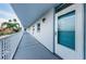 Exterior hallway with unit number and railing at 1868 Shore S Dr # 410, South Pasadena, FL 33707