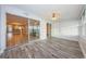 Living room with access to an open concept and screened in patio, beautiful flooring throughout at 1868 Shore S Dr # 410, South Pasadena, FL 33707