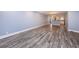 Large living area showcasing wood-look flooring and open layout at 1868 Shore S Dr # 410, South Pasadena, FL 33707