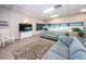 Relaxing living room with cozy sofas, rocking chair, and large windows for a bright atmosphere at 1868 Shore S Dr # 410, South Pasadena, FL 33707