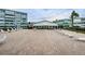 Community patio area with lounge chairs for relaxing and enjoying the weather at 1868 Shore S Dr # 410, South Pasadena, FL 33707