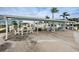 Covered outdoor lounge area with tables and seating for residents and guests to enjoy at 1868 Shore S Dr # 410, South Pasadena, FL 33707