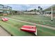 Classic shuffleboard courts ready for play, featuring clear markings and equipment for a fun outdoor activity at 1868 Shore S Dr # 410, South Pasadena, FL 33707