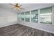 Sunroom featuring beautiful flooring and large windows with serene waterfront views at 1868 Shore S Dr # 410, South Pasadena, FL 33707