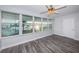 Sunroom featuring beautiful flooring and large windows with picturesque waterfront views at 1868 Shore S Dr # 410, South Pasadena, FL 33707