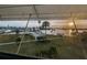 Beautiful sunset view from the property overlooking landscaped grounds and a swimming pool at 1868 Shore S Dr # 410, South Pasadena, FL 33707