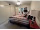 Spacious bedroom featuring a comfortable bed and ample closet space at 2426 Persian Dr # 64, Clearwater, FL 33763
