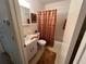 Bathroom with tub, shower, and updated fixtures at 2426 Persian Dr # 64, Clearwater, FL 33763