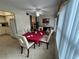 Elegant dining room featuring a table for four and large windows at 2426 Persian Dr # 64, Clearwater, FL 33763