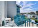 Balcony with water views and small seating area at 171 Medallion Blvd # H, Madeira Beach, FL 33708