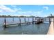 Private dock features a spacious platform and lift for boats at 20204 Gulf Blvd # 9, Indian Shores, FL 33785