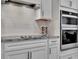 Modern kitchen with white cabinets and granite counters at 9509 Lamine Way, Parrish, FL 34219