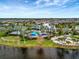 Community pool and clubhouse with lush landscaping at 9509 Lamine Way, Parrish, FL 34219