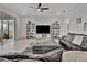Relaxing living room with sectional sofa, large TV, and backyard access at 9509 Lamine Way, Parrish, FL 34219