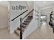 Elegant staircase with wrought iron railing at 9509 Lamine Way, Parrish, FL 34219