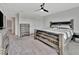 Spacious main bedroom with a large bed and dresser at 9509 Lamine Way, Parrish, FL 34219