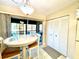 Small dining area with table and chairs, and access to the patio at 4529 Whitton Way # 223, New Port Richey, FL 34653