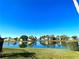 Scenic lake view with reflection of homes at 4529 Whitton Way # 223, New Port Richey, FL 34653