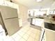 Kitchen with stainless steel appliances and a view into living room at 4529 Whitton Way # 223, New Port Richey, FL 34653