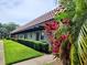 Building exterior showcasing Spanish-style architecture and landscaping at 1701 Pinehurst Rd # 26E, Dunedin, FL 34698