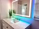 Modern bathroom with marble vanity and LED mirror at 1701 Pinehurst Rd # 26E, Dunedin, FL 34698