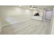 Bright living room features new flooring and a ceiling fan at 1701 Pinehurst Rd # 26E, Dunedin, FL 34698