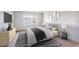 Well-lit bedroom featuring neutral tones, contemporary decor, and a comfortable bed at 10350 Imperial Point W Dr # 15, Largo, FL 33774