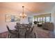 Open living room and dining area with stylish furnishings, decor, and ample natural light at 10350 Imperial Point W Dr # 15, Largo, FL 33774