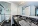 Bathroom with granite vanity and shower at 2699 Seville Blvd # 105, Clearwater, FL 33764