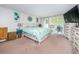 Bright bedroom with king bed and patio access at 2699 Seville Blvd # 105, Clearwater, FL 33764
