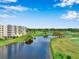 Aerial view of community with lake and golf course at 1200 Country Club Dr # 2106, Largo, FL 33771