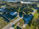 Aerial view of a vacant lot near a lake and other homes at 2850 Sunstream Ln, Clearwater, FL 33759