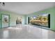 Bright living room with large windows overlooking tranquil scenery at 2850 Sunstream Ln, Clearwater, FL 33759