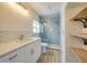 Modern bathroom with gray tile shower and white vanity at 2850 Sunstream Ln, Clearwater, FL 33759