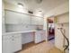 Small kitchen with white cabinets and appliances at 2850 Sunstream Ln, Clearwater, FL 33759
