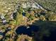 Aerial view showcasing a lakefront community with lush landscaping at 2850 Sunstream Ln, Clearwater, FL 33759