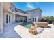 Backyard with pool, spa, stone patio, and covered seating area at 898 Skye Ln, Palm Harbor, FL 34683