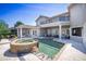 Backyard featuring a pool and spa with a covered patio and balcony at 898 Skye Ln, Palm Harbor, FL 34683