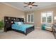 Spacious bedroom with built-in shelving, carpeted floors, and ample natural light at 898 Skye Ln, Palm Harbor, FL 34683