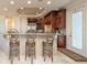 Kitchen with breakfast bar and three ornate barstools at 898 Skye Ln, Palm Harbor, FL 34683