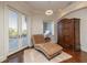 Relaxing sitting area with chaise lounge and French doors at 898 Skye Ln, Palm Harbor, FL 34683