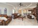 Spacious living room with leather sofas, a coffee table, and hardwood floors at 898 Skye Ln, Palm Harbor, FL 34683