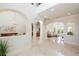 Open living area with high ceilings and views to backyard at 898 Skye Ln, Palm Harbor, FL 34683